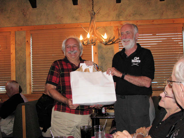 a1a215.jpg - Wayne Jones receving his retirement from the Board present from Pres. Bill J Wallace